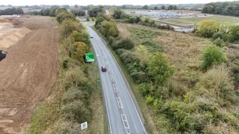 Shaun Whitmore/BBC An aerial view of the A47 with preparatory work on one side 