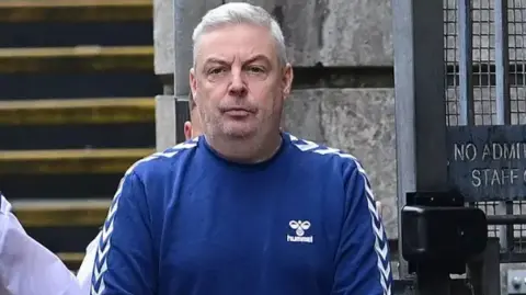 Christopher Paul O'Kane pictured in a blue sweatshirt