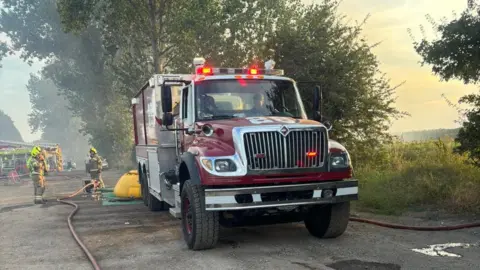 Brandon Fire Station A water carrier with its lights flashing