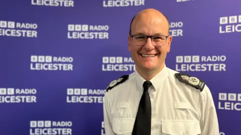 A man in a police officer's uniform 