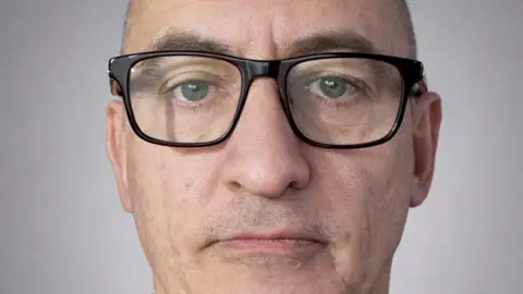 The Online Dating and Discovery Association A facial photo of Simon Newman from The Online Dating and Discovery Association. He is white and is wearing glasses