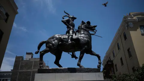 Getty Images The statue of Spanish conqueror of the Incan Empire and founder of the city of Lima Francisco Pizarro is pictured during the ceremony of its reinstallation in Lima, Peru, January 18, 2025