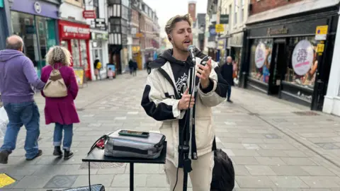 BBC Jason Allan busking on the street