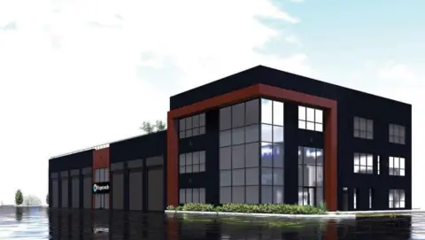 An architect's digital art designs for the modernised bus depot. It is a three-storey building, with lots of glass windows. The majority of the building is black, with some brown decorative accents. There is also some greenery at the base of the corner of the building.