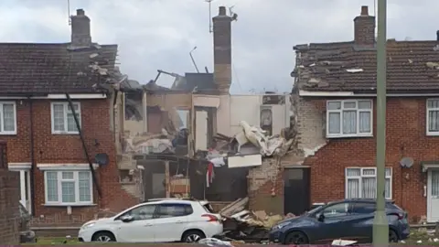 Local handout Damaged houses in Mill View, Willesborough, in 2021