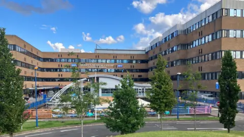 External view of the Queen's Medical Centre, a large five-story 1970s hospital building