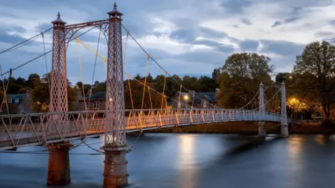 The infirmary footbridge in Inverness in evening twilight.