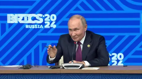 An image of Putin speaking during a Brics press conference