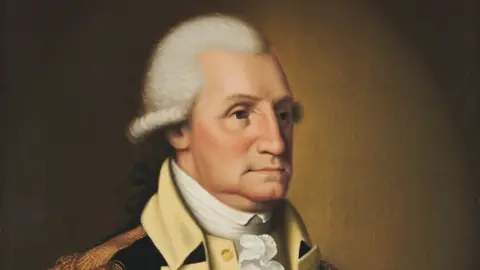 Harvard Art Museums Collection / Wikicommons A portrait painted by Edward Savage in 1790 of George Washington. He is wearing military dress, with a white powder wig on his head.