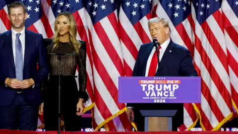 Eric Trump, executive vice president of Trump Organization Inc., from left, Lara Trump, co-chair of the Republican National Committee, former US President Donald Trump, and former US First Lady Melania Trump during an election night event at the Palm Beach Convention Center in West Palm Beach, Florida, US, on Wednesday, Nov. 6, 2024. 