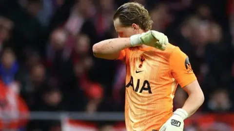 Tottenham keeper Antonin Kinsky reacts after being replaced against Atletico Madrid in the Champions League