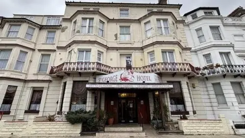 Local Democracy Reporting Service The front of the St George Hotel - a four-storey, white and cream building with multiple bay windows.