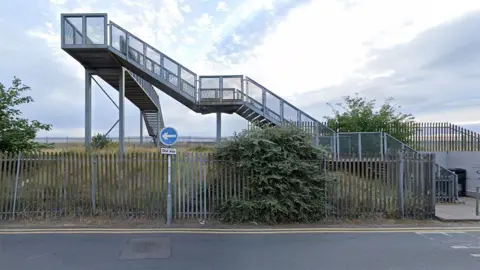 Google street view of the grey metal footbridge on Harrington Street in Cleethorpes 