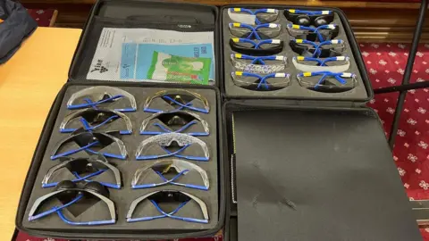 BBC/Georgia Levy Collins A case of spectacles specially designed to simulate sight conditions.