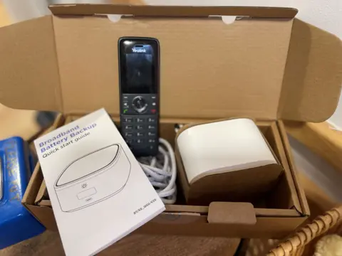 A backup broadband battery kit with box and phone unit