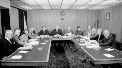 The BBC Board of Governors at their fortnightly meeting at Broadcasting House.
(l-r) Sir John Johnston, Alywn Roberts, national governor for Wales, Stella Clarke, George Howard, Ian Trethowan, director general, Michael Swann FRS chairman, Mark Bonham Carter, vice-chairman, Lady Faulkner of Downpatrick, national governor for Northern Ireland, Gerard Mansell, deputy director-general, Prof Hugh Longuet-Higgins FRS, Lady Serota and Roger Young, national governor for Scotland