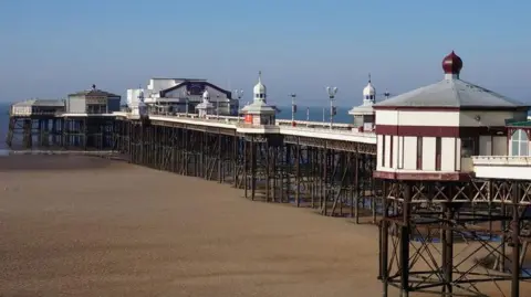 North Pier above the sands at Blackpool with the sea in the background