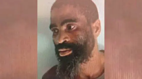 A mugshot of James Neo Tshoaeli, nicknamed Tiger, that was released by police