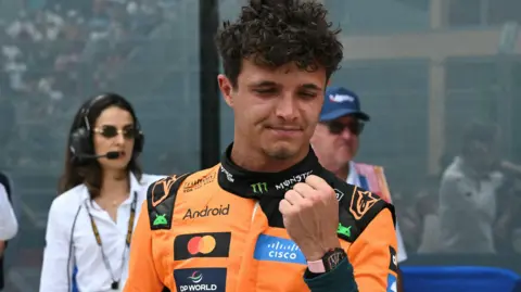 McLaren's Lando Norris clenches his fist in celebration after winning the Miami Grand Prix sprint race