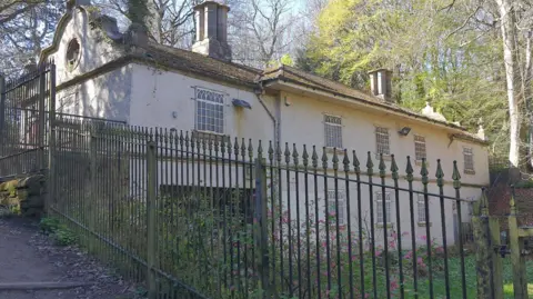 The Victorian-era Birley Spa, with both its building and surrounding grounds in a state of disrepair and decay.