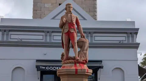 ABC News/Tony Ibrahim Paint covers the statue of Captain Cook