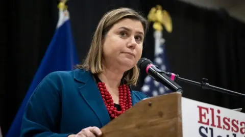 Elissa Slotkin stands at a podium 