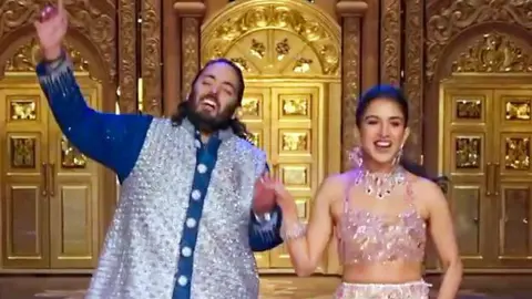 ANI  Reliance Industries Chairman Mukesh Ambani's son Anant Ambani and his fiancé Radhika Merchant present a special perform during the sangeet ceremony ahead of their wedding, at Jio World Centre in Mumbai on 6 July