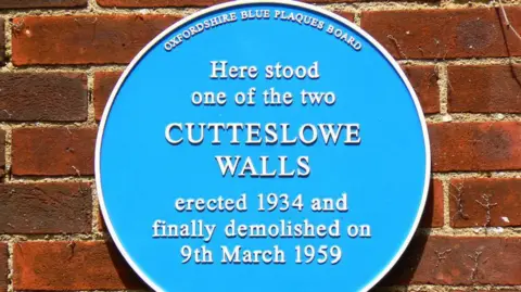 Brian Robert Marshall A blue plaque marking where one of the Cutteslowe Walls once stood.