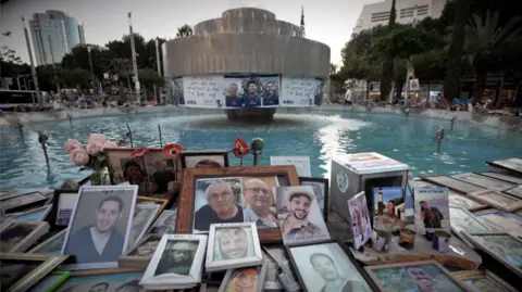 Nik Millard/BBC Photos of people killed in the Hamas-led attacks on 7 October 2023 and Gaza war at Dizengoff Square in Tel Aviv