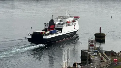 The Ben-my-Chree, which is black, white and red, sailing out of Douglas Harbour.