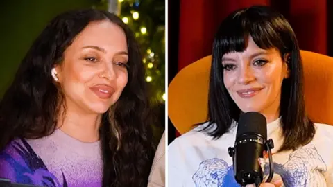 Composite image of Jade and Lily Allen smiling at each other. Both have long dark hair. Lily holds a mic
