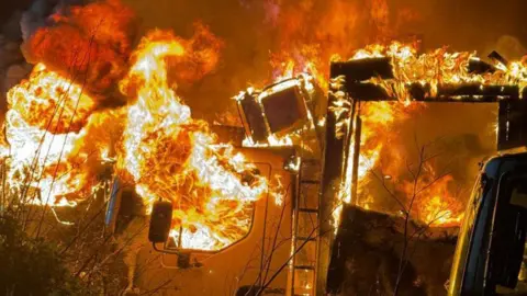 Essex County Fire & Rescue Service A close-up of a lorry engulfed in flames