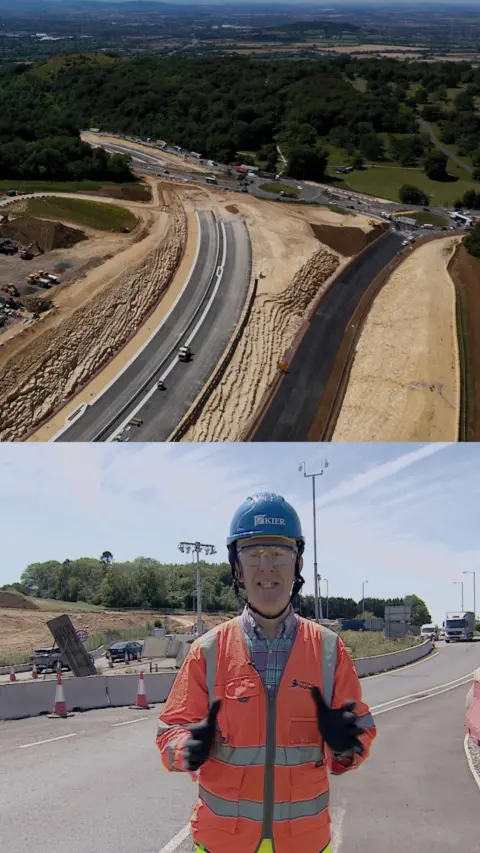 An aerial shot of the A417 roadworks and a reporter below with high-vis jacket on and a blue helmet.