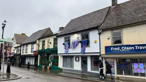 Shaun Whitmore/BBC Shops and businesses across Ipswich have decorated their fronts in support of the club