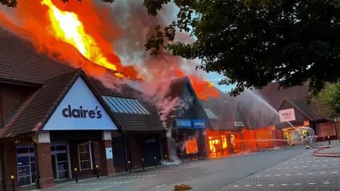 Leicestershire Fire and Rescue Service Shops on fire at Thurmaston Shopping Centre, in Leicestershire.