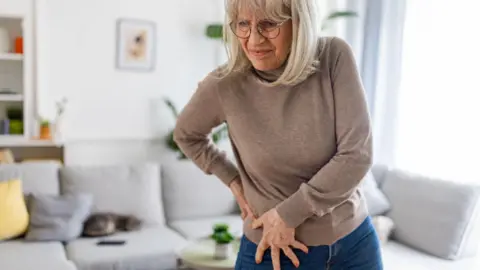 Getty Images Woman with hip pain