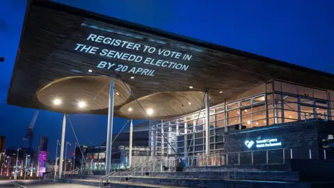 Getty Images A message encouraging people to vote is projected onto the roof of the Senedd, home of the Welsh Parliament.