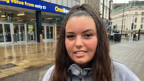 Sam Read/BBC Julia Hotaj smiling at the camera