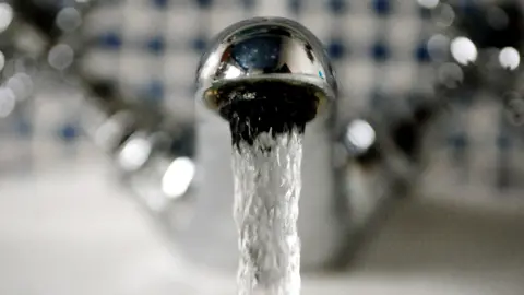 A water tap running