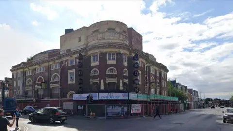 Google The former Crown cinema sits on the junction of two roads. It's a brick built Edwardian building, very large but very delapidated with vegetation growing out of the roof 
