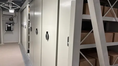 Grey filing cabinets in an underground part of a building