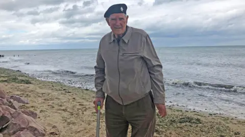 PA Media D-Day veteran Albert Price, then 93, when he returned to the seafront on Gold Beach in Arromanches-les-Bains, France, where veterans landed 75 years before, to lay crosses and remember their fallen comrades.
