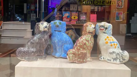 104 Projects Pottery dogs in window 