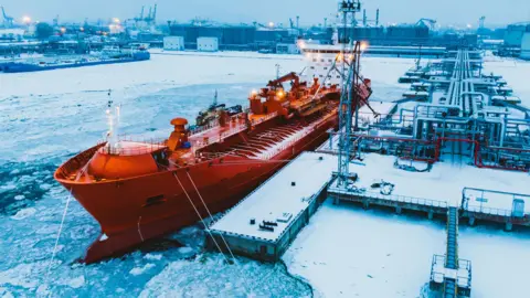 A tanker docked in port in arctic waters
