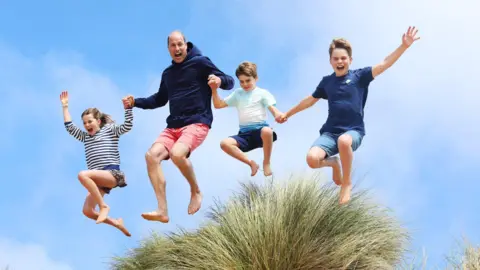 Kensington Palace Prince William jumps in the air with his children