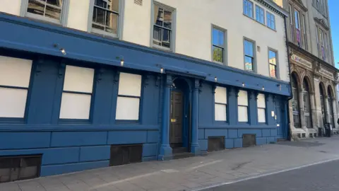 The outside of the former Brewdog building in Queen Street in Norwich. There is no signage on the building but parts of the exterior are painted blue.