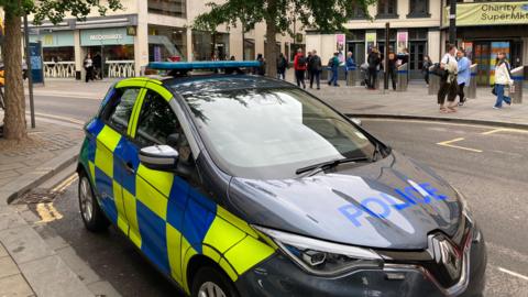 A police car outside the area in which the attack happened