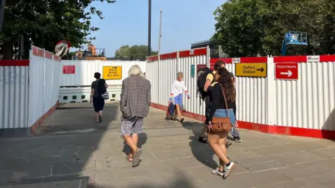 People using the walkways while Botley Road is closed 