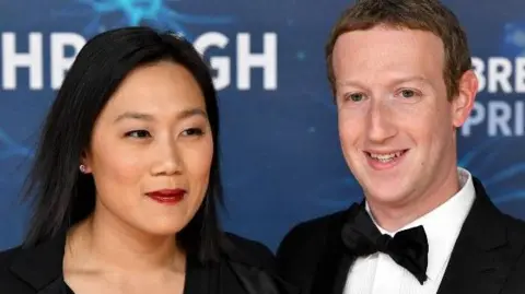 Getty Images Mark Zuckerberg (right) and wife Priscilla Chan, pictured together dressed smartly at the 2020 Breakthrough Prize Ceremony at NASA Ames Research Center