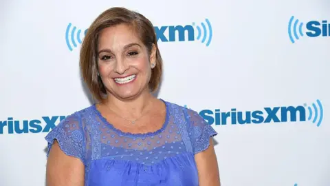 Getty Images Gymnast Mary Lou Retton visits at SiriusXM Studio on August 9, 2016 in New York City. She wears a blue top.